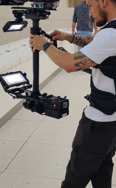 Jonathan Calero operating steadicam on a rooftop 