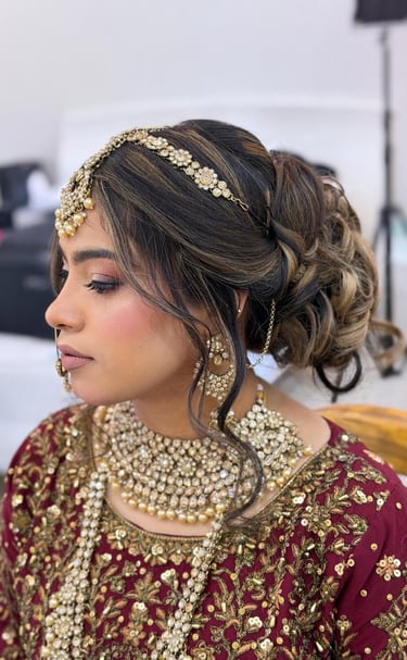 a woman in a red and gold outfit with a gold headpiece, Bridal Makeup Dubai Marina