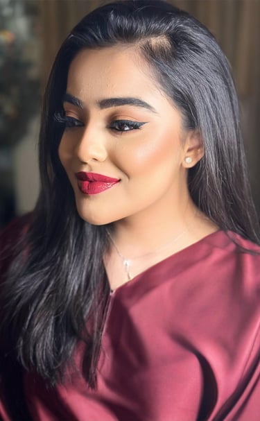 a woman with long hair and a red dress, party makeup dubai