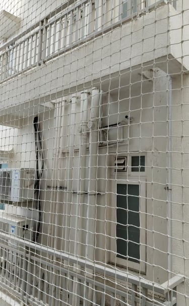 Close-up of a securely installed balcony safety net in a modern apartment in Anna Nagar.