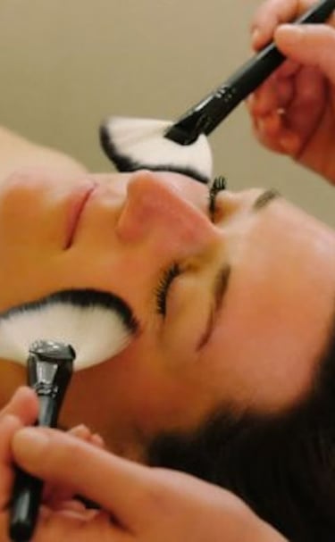 woman receiving  gentle face brushing