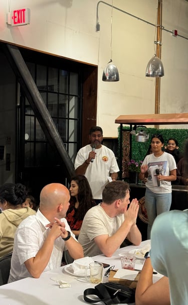 Bollywood Trivia night with hosts asking questions in Chai tea shirts