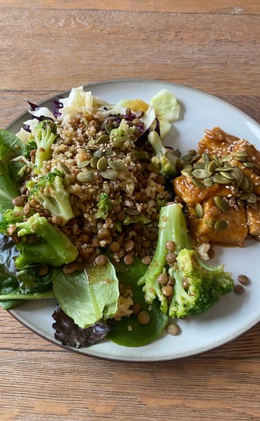 a plate of food with a salad and a fork
