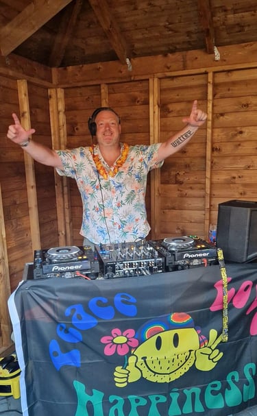 a dj in a hawaiian outfit