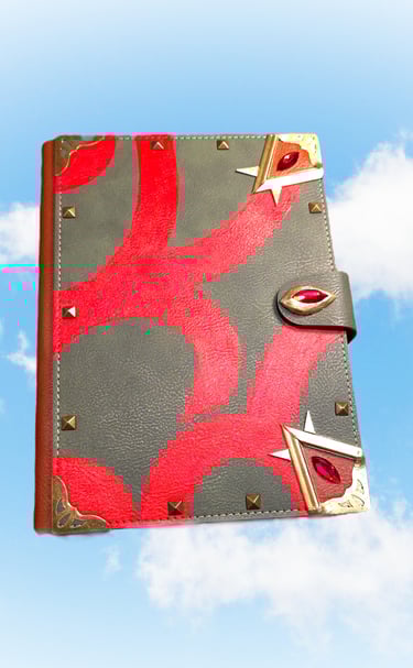 Handmade leather fantasy spellbook with red velvet patterns and ruby crystals floating in a blue sky.