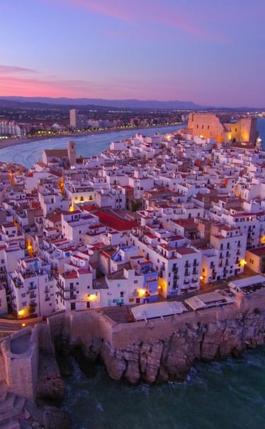 Peñiscola. a cityscape of a small town with a castle like structure