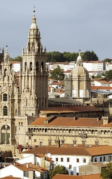 Santiago de Compostela. a large cathedral style church with a steeple tower