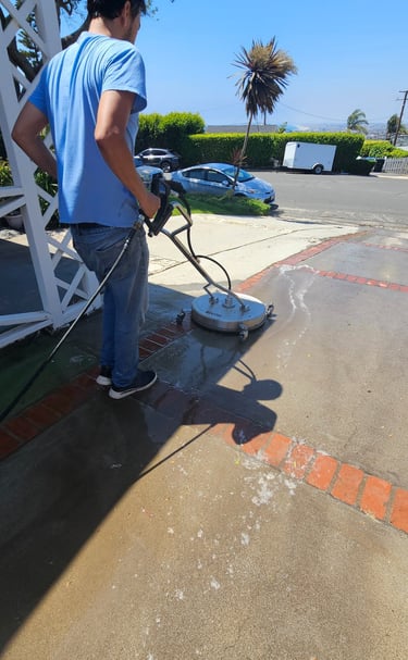power washing using a surface cleaner a driveway