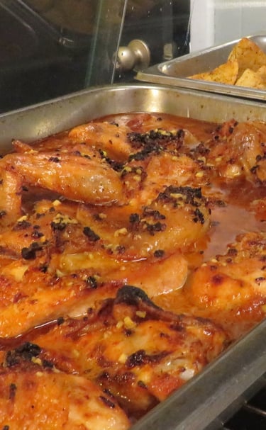 Slow roasted with chicken in a metal catering pan