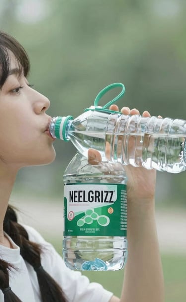 green glass bottle beside drinking glass