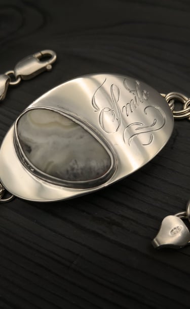 Remebering the one's we love, sterling silver bracelet ladened with sentimental meaning