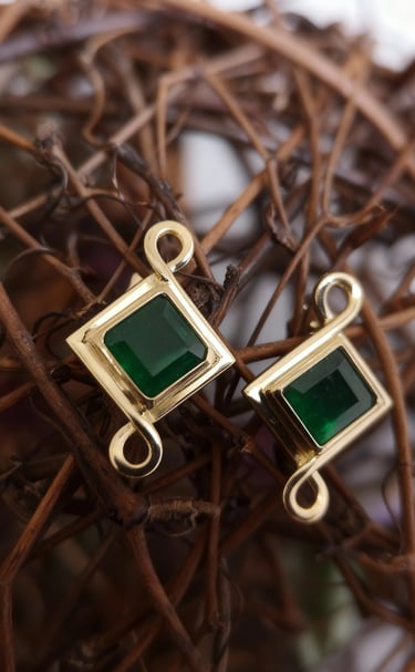 Emerald Earrings personally designed utilizing the infinity sign in 18kt gold Kelly Allanson