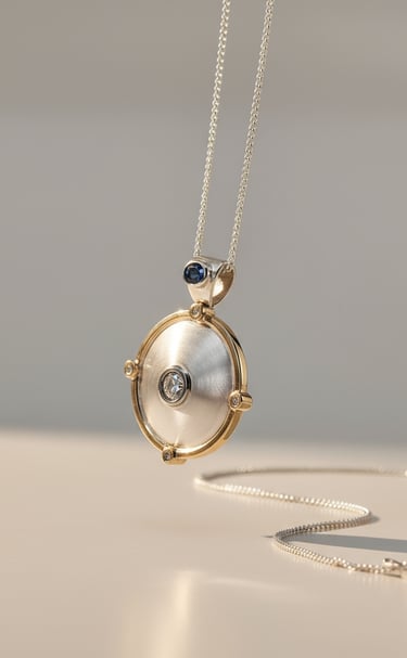 Memorial Pendant. Set with 1.5ct diamond and sapphire in Sterling silver & 14kt gold