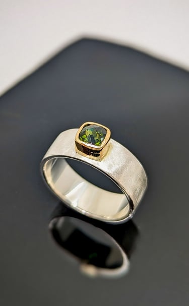 Sterling SIlver Hand fabricated ring set with a chrome green tourmaline in 14kt yellow gold