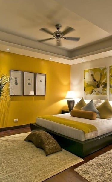 a bedroom with a bed and a ceiling fan