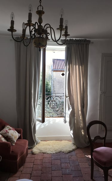 a living room with a chandelier and a chandelier