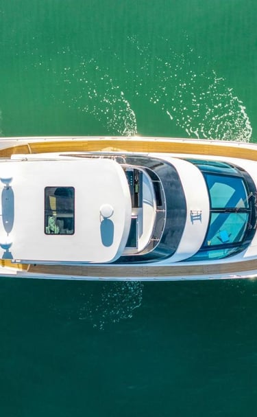 a boat with a large white boat in the water