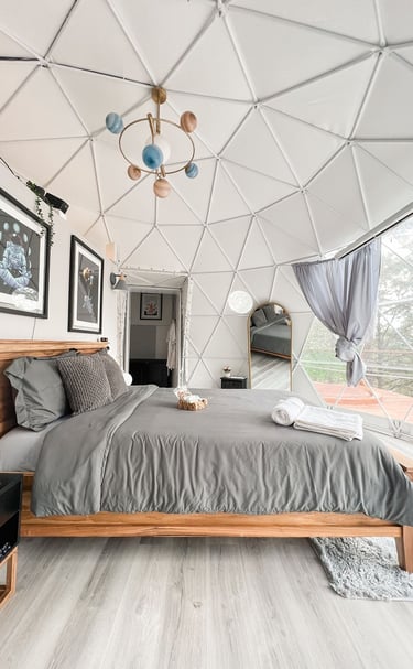 a bedroom with a bed and a large bed