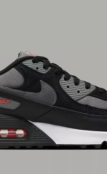 Nike Air Max 90 sneakers in Black, Pewter Gray, and University Red colorway with visible Air cushioning