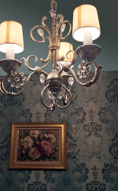soft teal gilded wallpaper, oil painting and silver chandelier