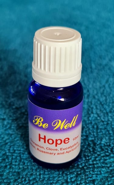 Hope Essential Oil displayed on a teal blanket