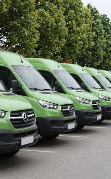 An outdoor shot of commercial cleaning vehicles lined up, ready for deployment.