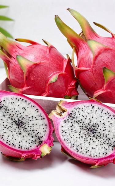 Close-up of vibrant red and white dragon fruits freshly harvested on the farm.