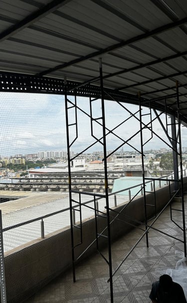 Close-up of a sturdy pigeon net tightly secured on a Vasai balcony.