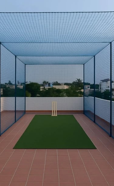 Close-up of a sturdy sports net securely installed on a Mumbai terrace under bright sunlight.