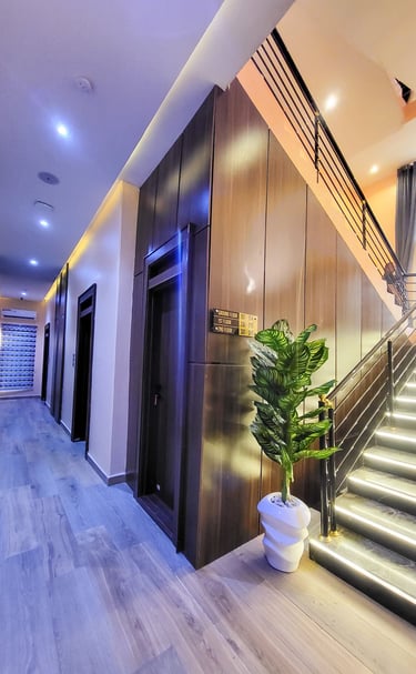 Bright and inviting hotel lobby with modern furniture and warm lighting.