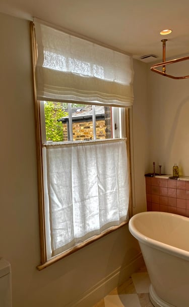 chorki bathroom with a roman blind and cafe voile curtains