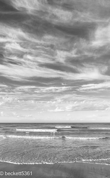 Henley Beach waves and clouds. Black and white