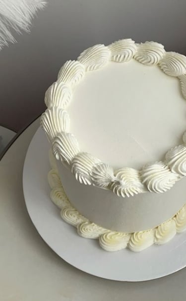 top and bottom border vegan vanilla cake with vanilla frosting