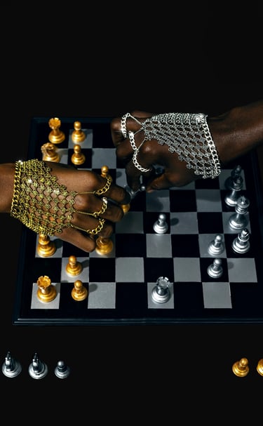 a person's hand wearing a chainmail while playong chess