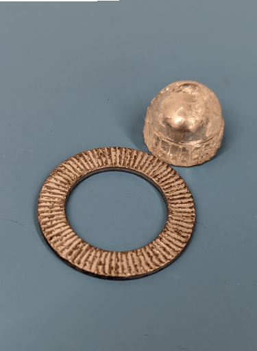 a metal object with a ring on it