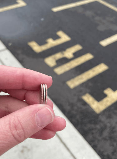 a person holding a ring with a ring on it
