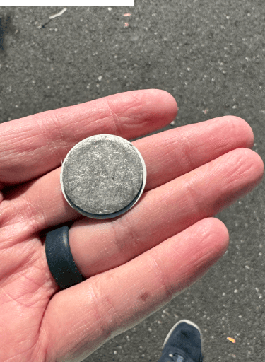 a person holding a coin with a coin