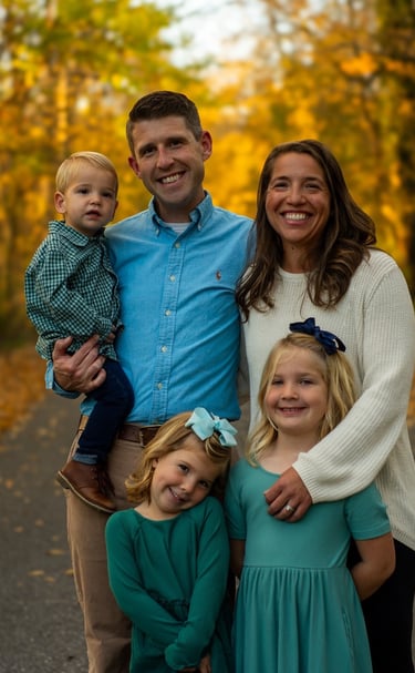 A family posing in the fall