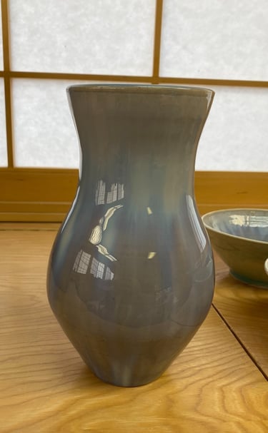 A blue and grey ceramic vase