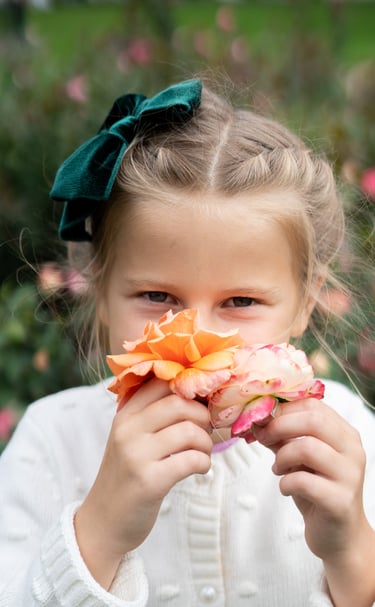 a little girl with a flower in her hair