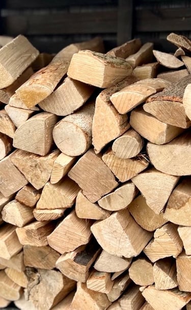 Premium kiln dried logs stacked in a log store