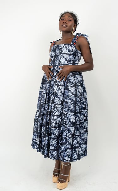 a woman in a blue dress and heels