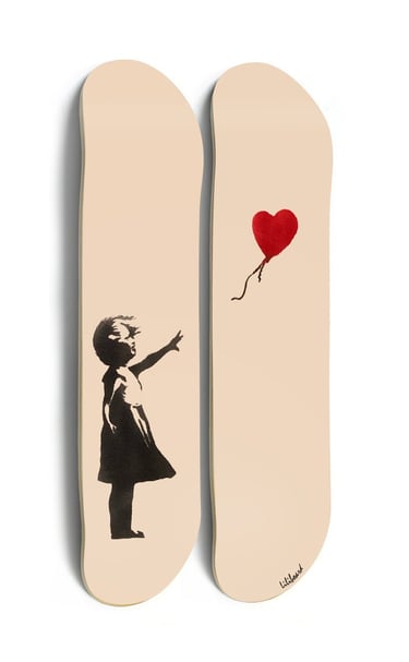 a pair of skateboards with a girl with a balloon