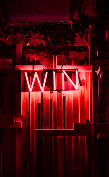 a wine bar with a neon light sign red written 'WIN'. - Swrill