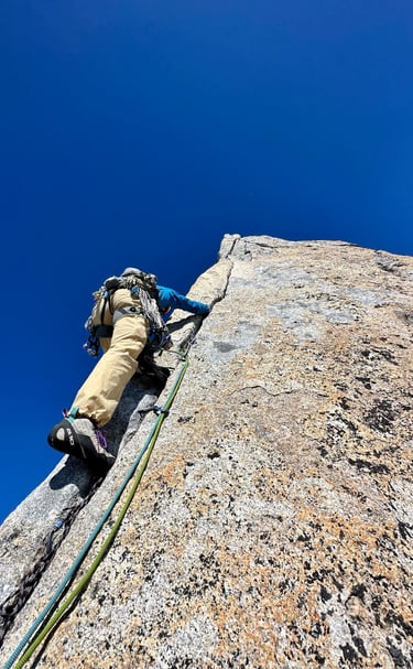 Hand jamming on Spigolo Vinci, Pizzo Cengalo. Valmasino, Italy