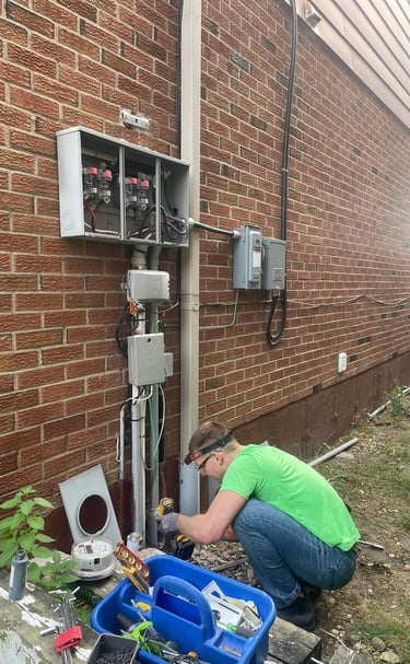 Licensed electricians at XBOCT (XB) Electric installing solar system for net metering