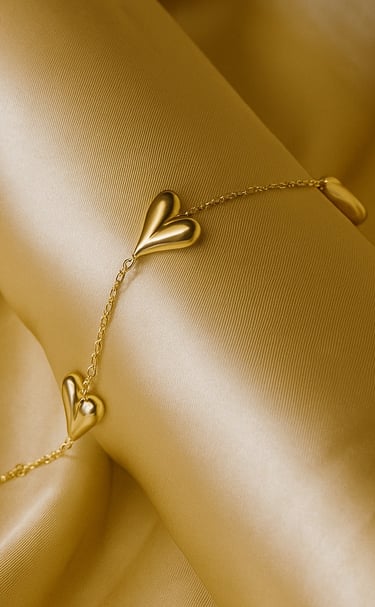 a gold bracelet bracelet bracelet bracelets with a heart shaped leaf