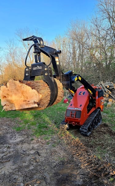 Wood and debris machine for tree removals and trimming. A handy helper with our Olathe Kansas jobs