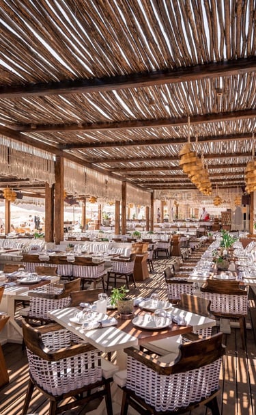 a restaurant with tables and chairs and a wooden table