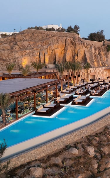 a large pool with a mountain in the background